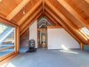 Wohnbereich mit Kamin und Studio Dachgeschoss